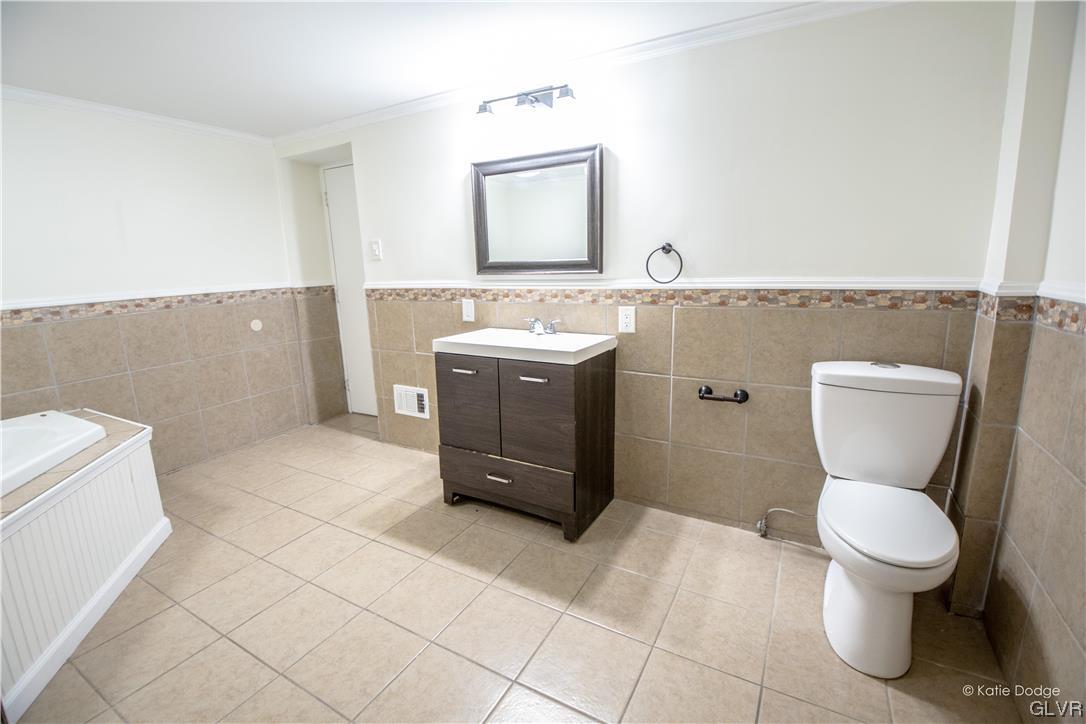 395 Buttermilk Road Easton, PA 18042 - Photo 19 of 41 a bathroom with a sink toilet and mirror