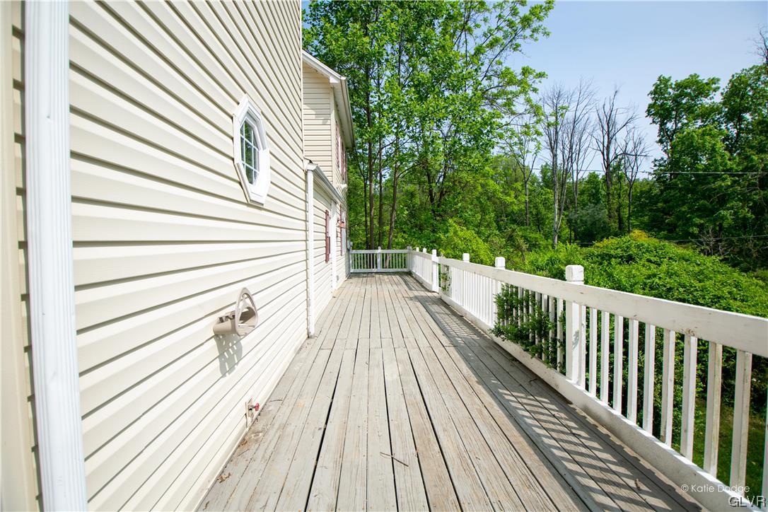 395 Buttermilk Road Easton, PA 18042 - Photo 30 of 41 a view of a wooden deck with a garden