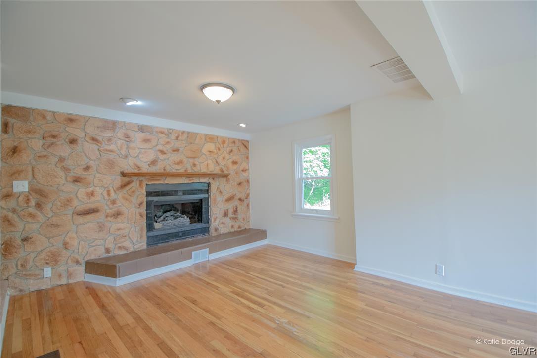 395 Buttermilk Road Easton, PA 18042 - Photo 3 of 41 an empty room with windows and fireplace