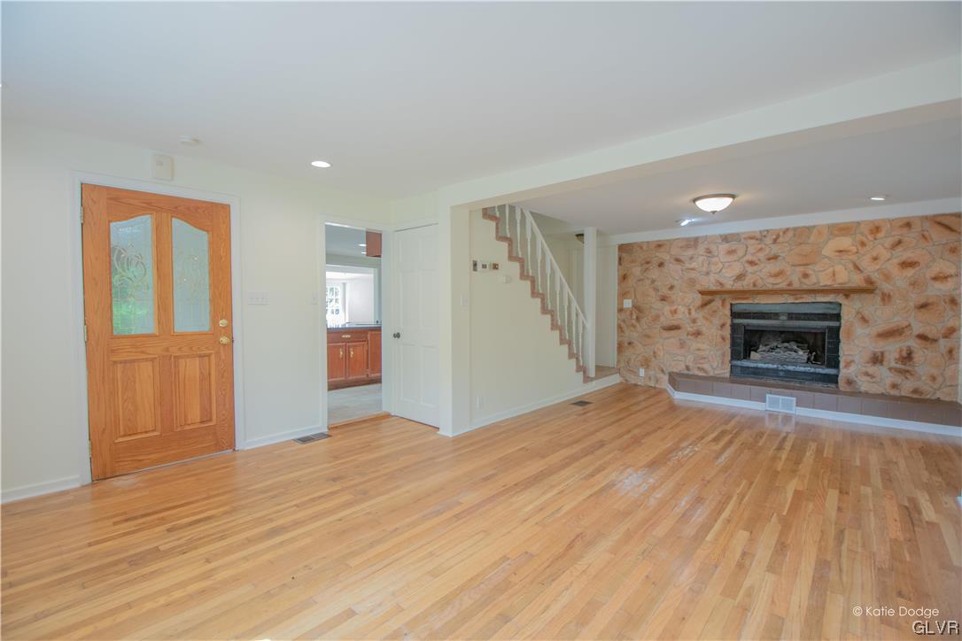 395 Buttermilk Road Easton, PA 18042 - Photo 4 of 41 a view of empty room with fireplace and wooden floor
