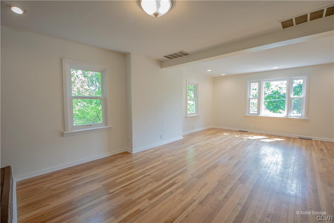 395 Buttermilk Road Easton, PA 18042 - Photo 5 of 41 a view of an empty room with wooden floor and a window
