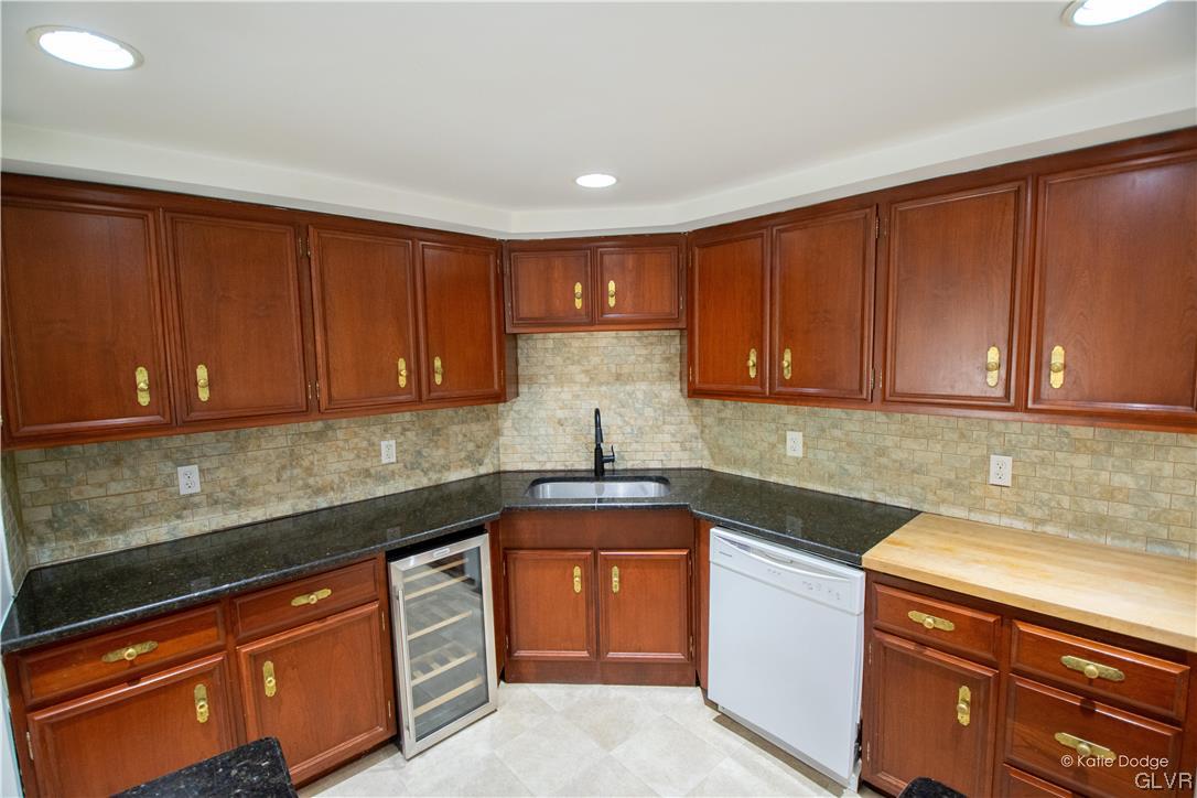 395 Buttermilk Road Easton, PA 18042 - Photo 7 of 41 a kitchen with stainless steel appliances granite countertop wooden cabinets a sink and dishwasher
