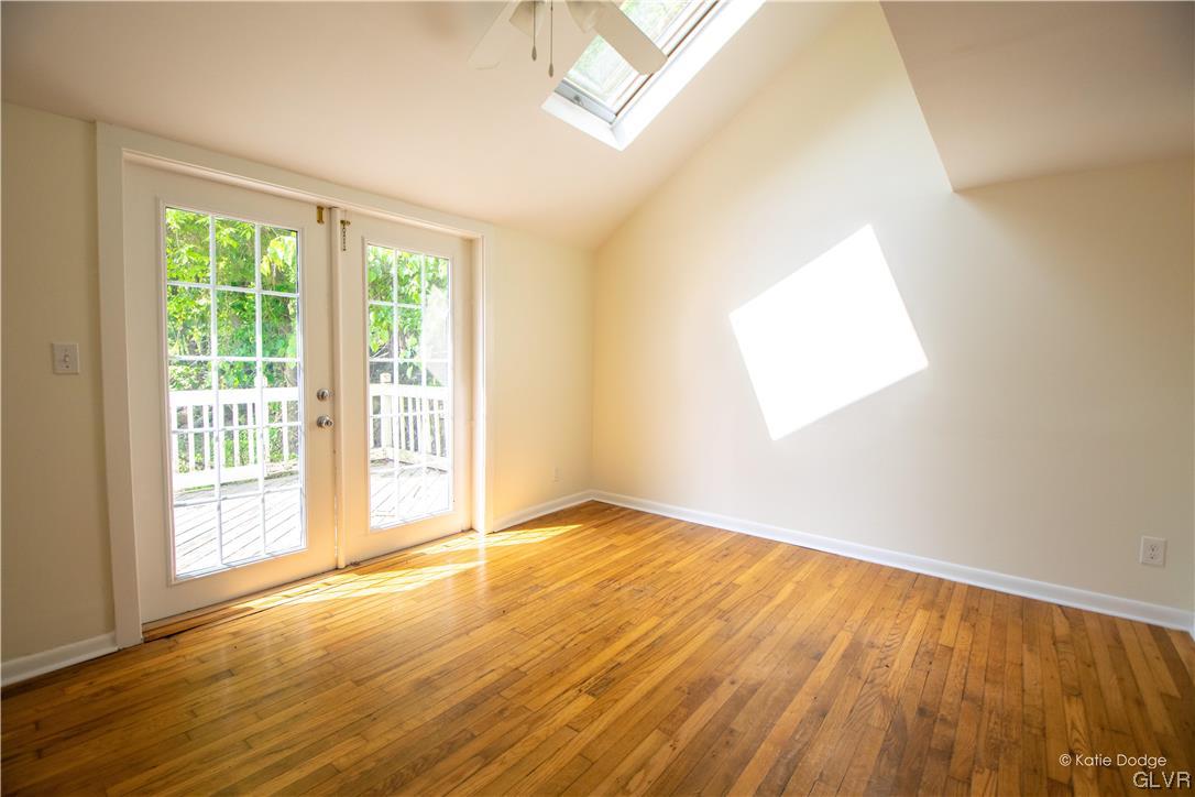 395 Buttermilk Road Easton, PA 18042 - Photo 10 of 41 an empty room with wooden floor and windows