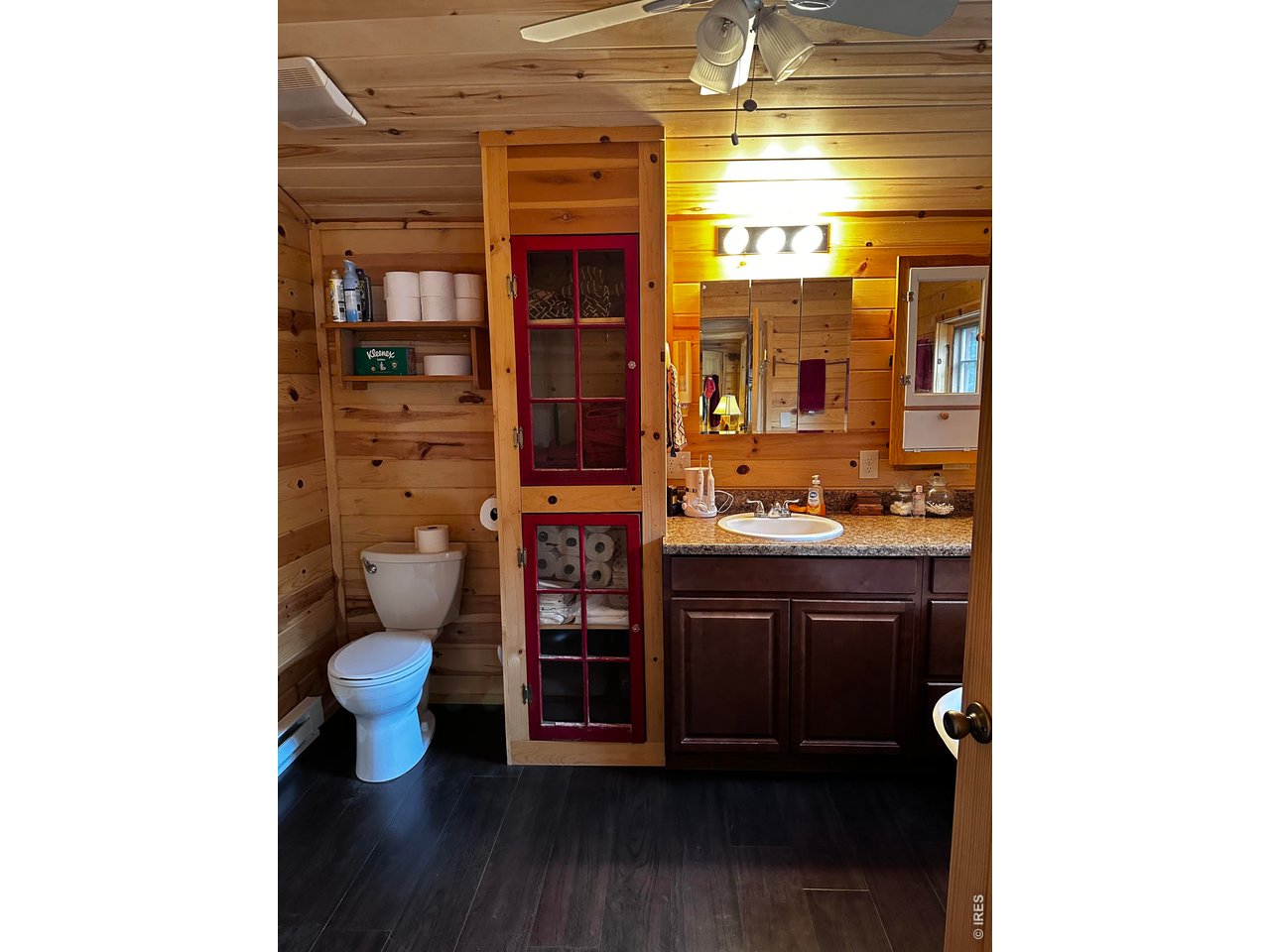 3154 Riverside Drive Lyons, CO 80540 - Photo 20 of 25 Bathroom showing divided light windows repurposed as linen closet doors