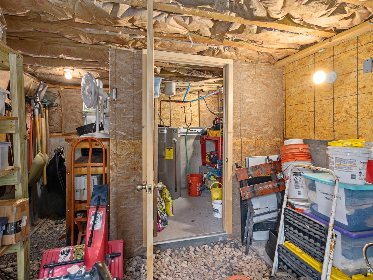 3154 Riverside Drive Lyons, CO 80540 - Photo 24 of 25 Basement area that hold Hot water heater, pressure tank, pump and additional storage.