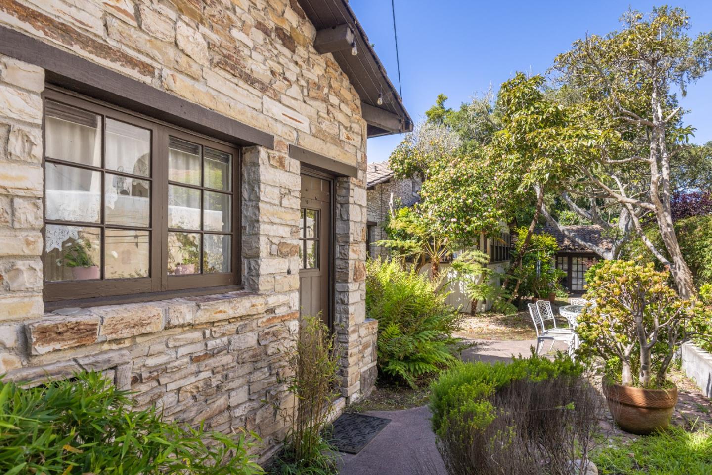 25286 Hatton Road Carmel, CA 93923 - Photo 5 of 34 a front view of a house with a yard