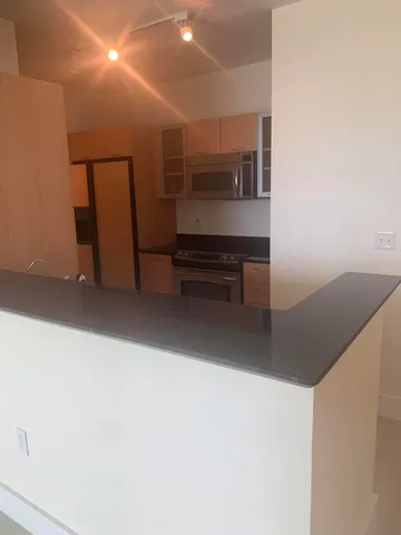 a view of kitchen and utility room