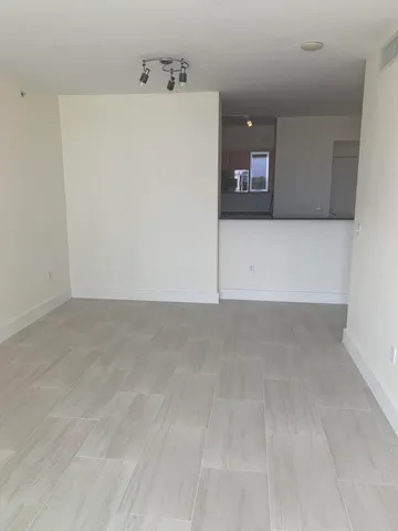 a view of a refrigerator in a kitchen