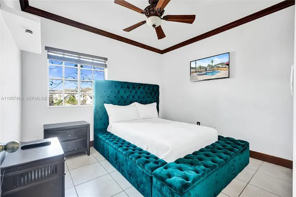 a bedroom with a bed and window
