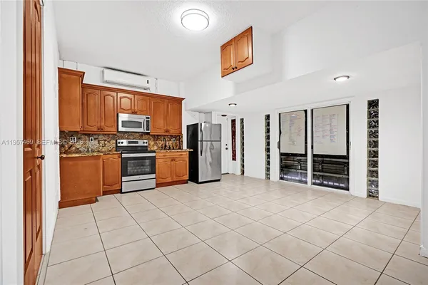 a kitchen with stainless steel appliances cabinets and a kitchen