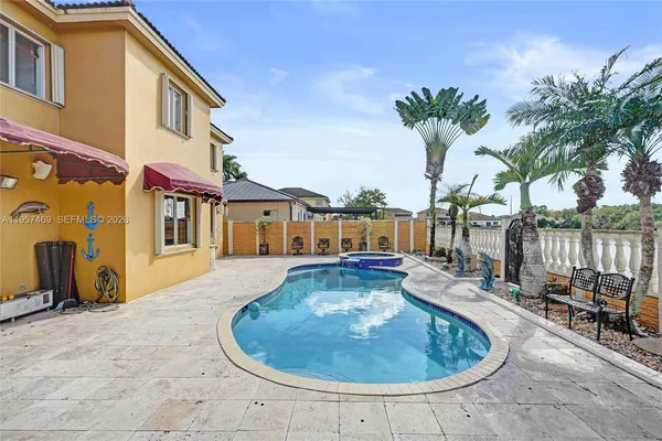 a view of a house with swimming pool