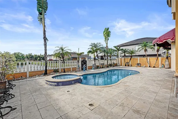 a outdoor space with swimming pool and furniture