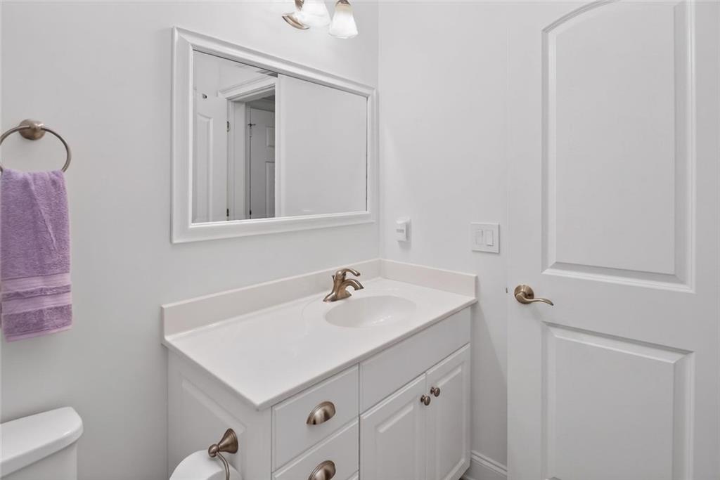 4113 Ledan Extension Gainesville, GA 30506 - Photo 178 of 195 a bathroom with a sink vanity and a toilet