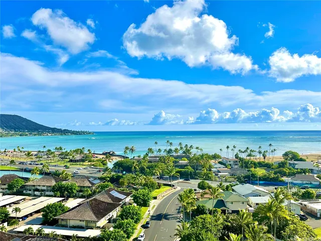 a kitchen with a sink a stove and cabinets