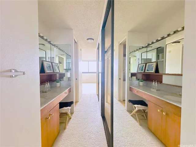 an aerial view of ocean with residential houses with outdoor space