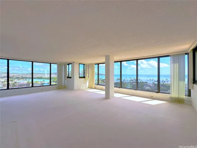 a view of an empty room with a large window