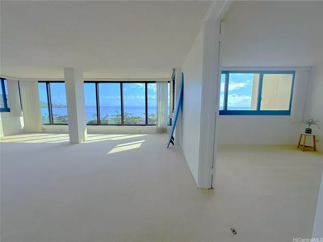 a view of an empty room with a large window