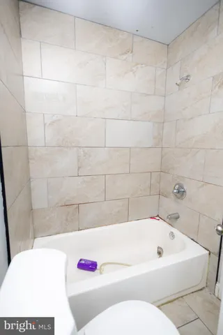 a kitchen with stainless steel appliances granite countertop wooden cabinets a stove top oven a sink and dishwasher