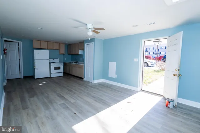 wooden floor in an empty room and a window