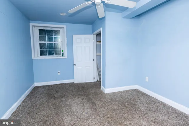 a view of a backyard with large trees