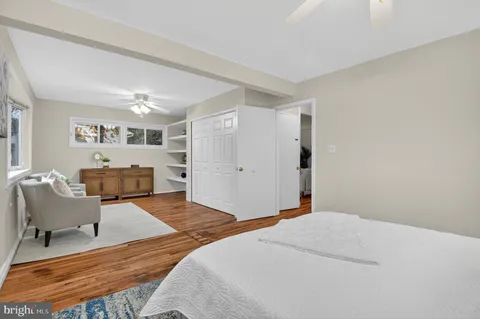 a bedroom with a large bed and furniture