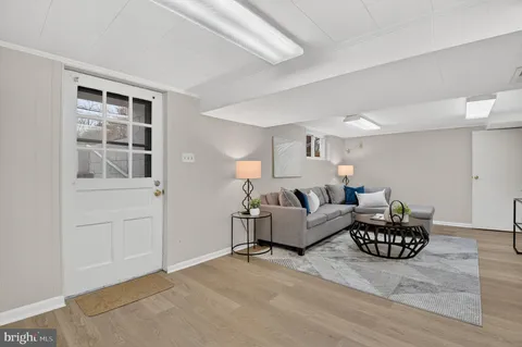 a living room with fireplace furniture and decor