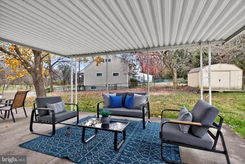a outdoor living space with furniture and garden view