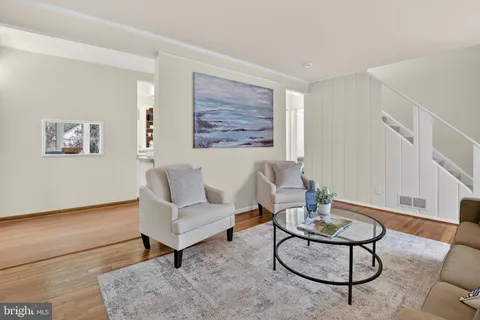 a living room with furniture and a rug