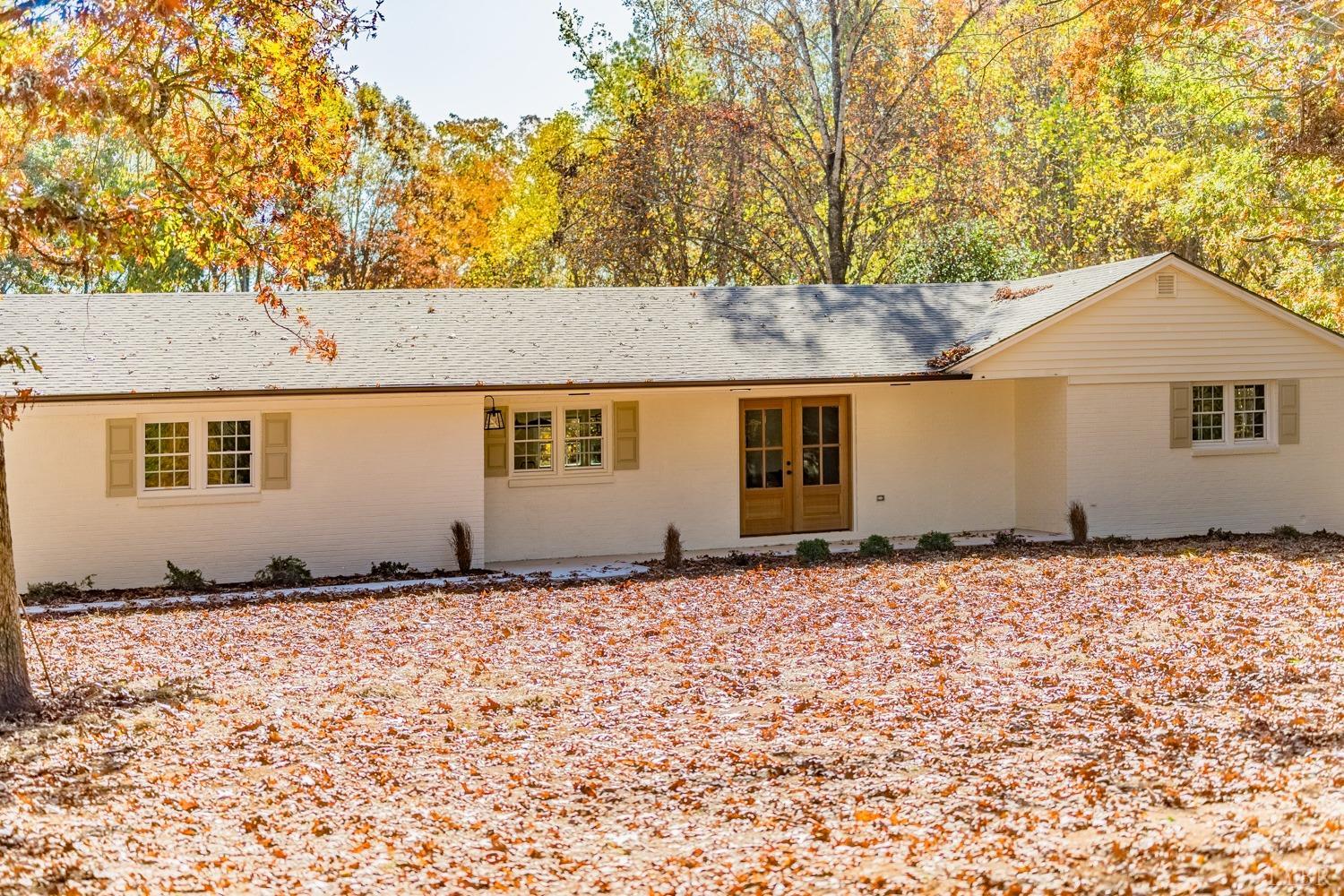 a house with trees in the background