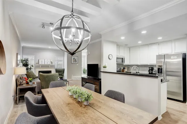 a kitchen with a sink a stove and cabinets