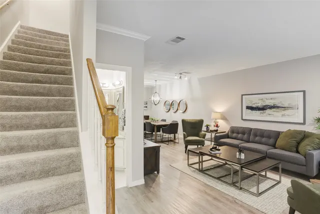 a bathroom with a granite countertop sink a mirror and a shower