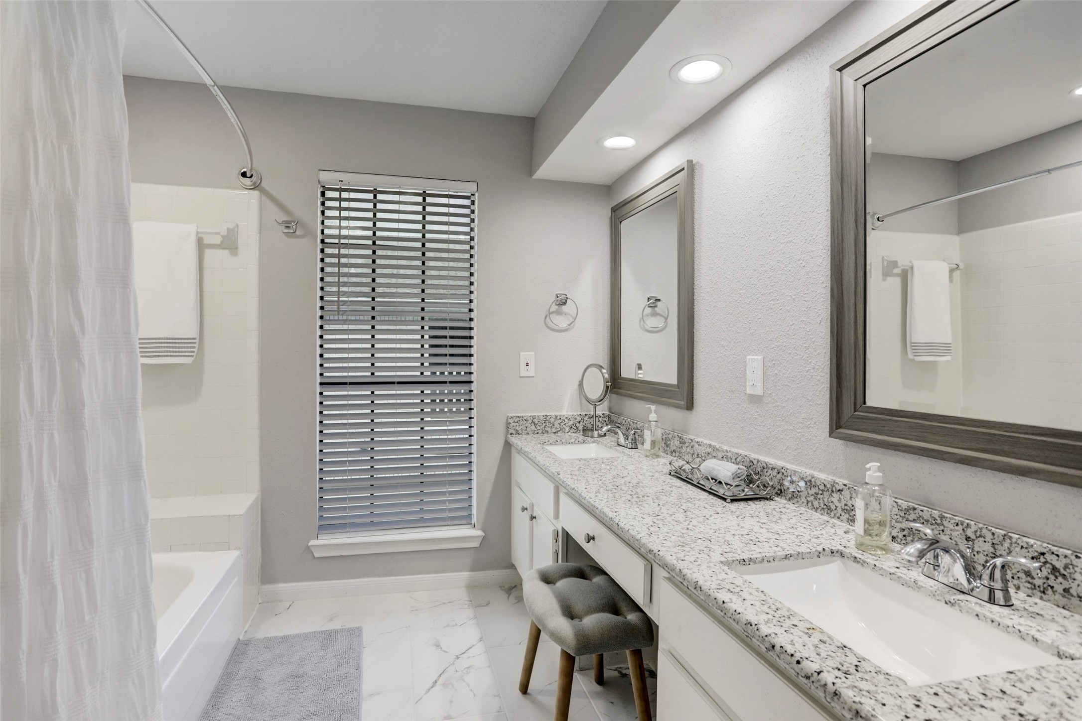 1911 Bering Drive, Unit 34 Houston, TX 77057 - Photo 20 of 26 a bathroom with a granite countertop sink and a mirror