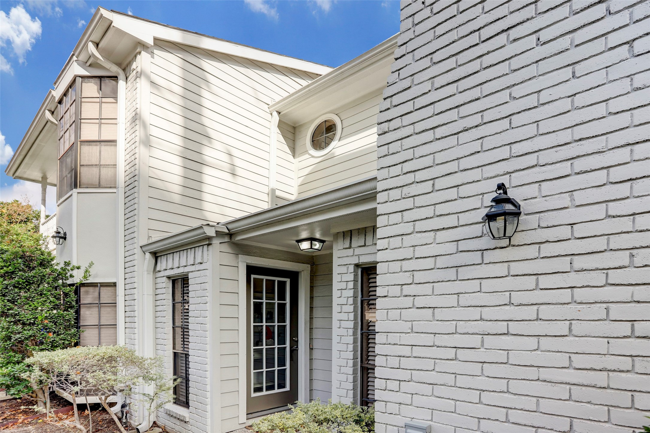 1911 Bering Drive, Unit 34 Houston, TX 77057 - Photo 2 of 26 a view of a house with a large windows