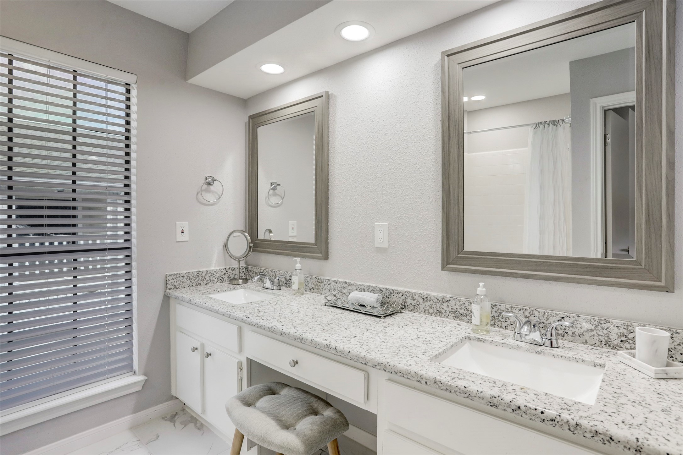 1911 Bering Drive, Unit 34 Houston, TX 77057 - Photo 21 of 26 a bathroom with a granite countertop sink double and mirror