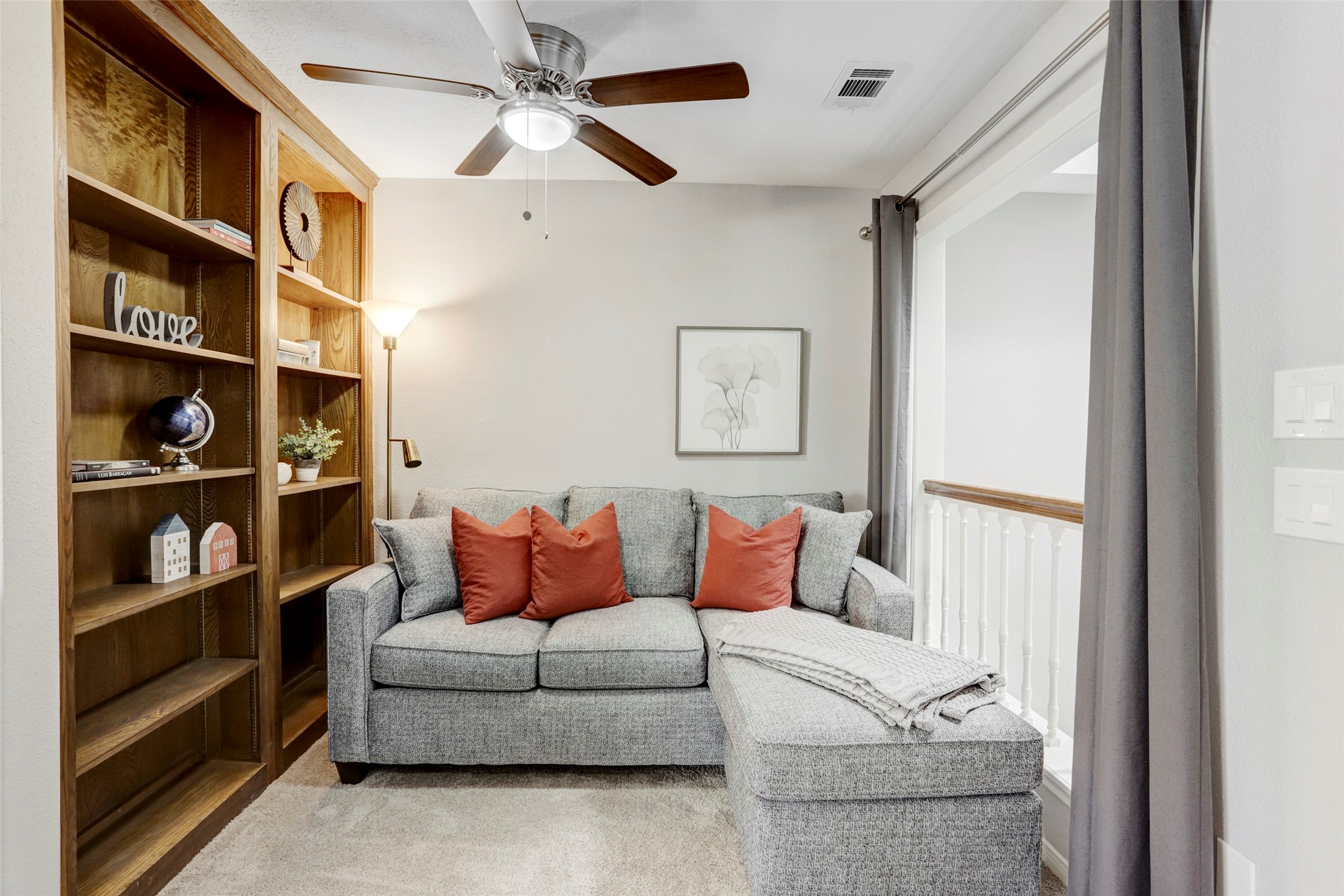 1911 Bering Drive, Unit 34 Houston, TX 77057 - Photo 22 of 26 a living room with furniture and a book shelf