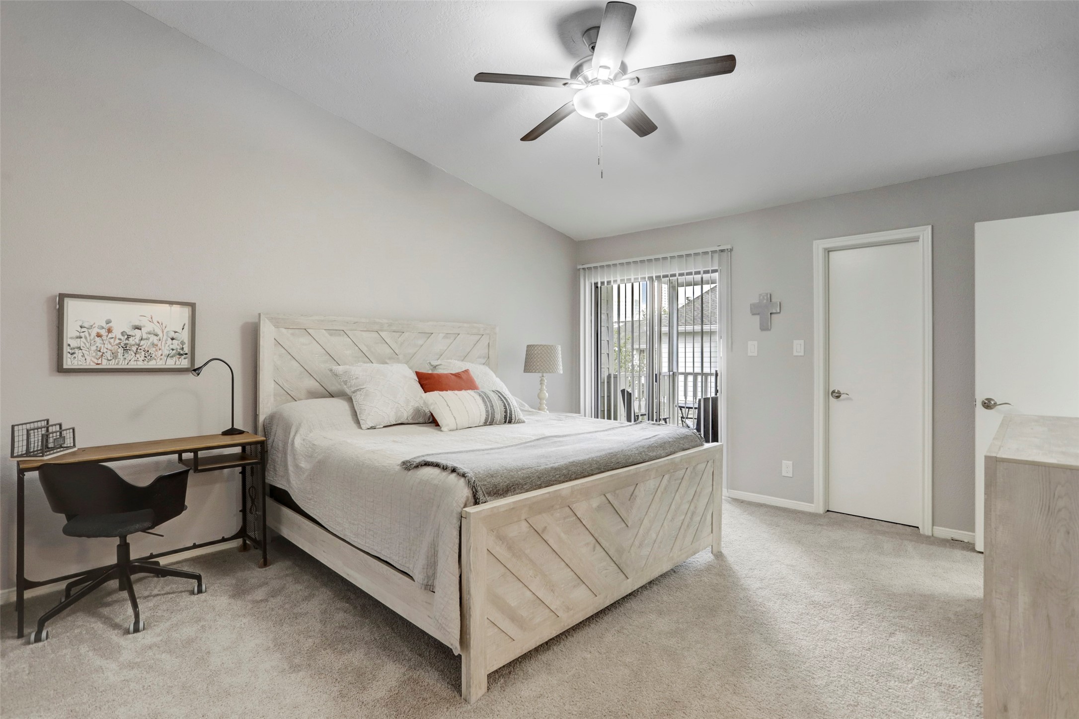 1911 Bering Drive, Unit 34 Houston, TX 77057 - Photo 24 of 26 a bedroom with a bed chandelier and a window