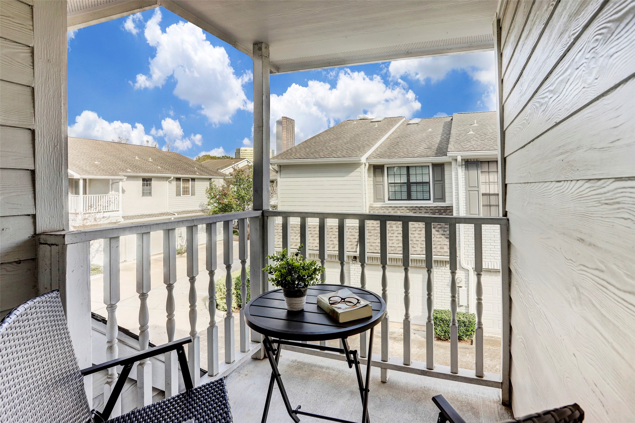 1911 Bering Drive, Unit 34 Houston, TX 77057 - Photo 25 of 26 a view of a balcony with a table and chairs