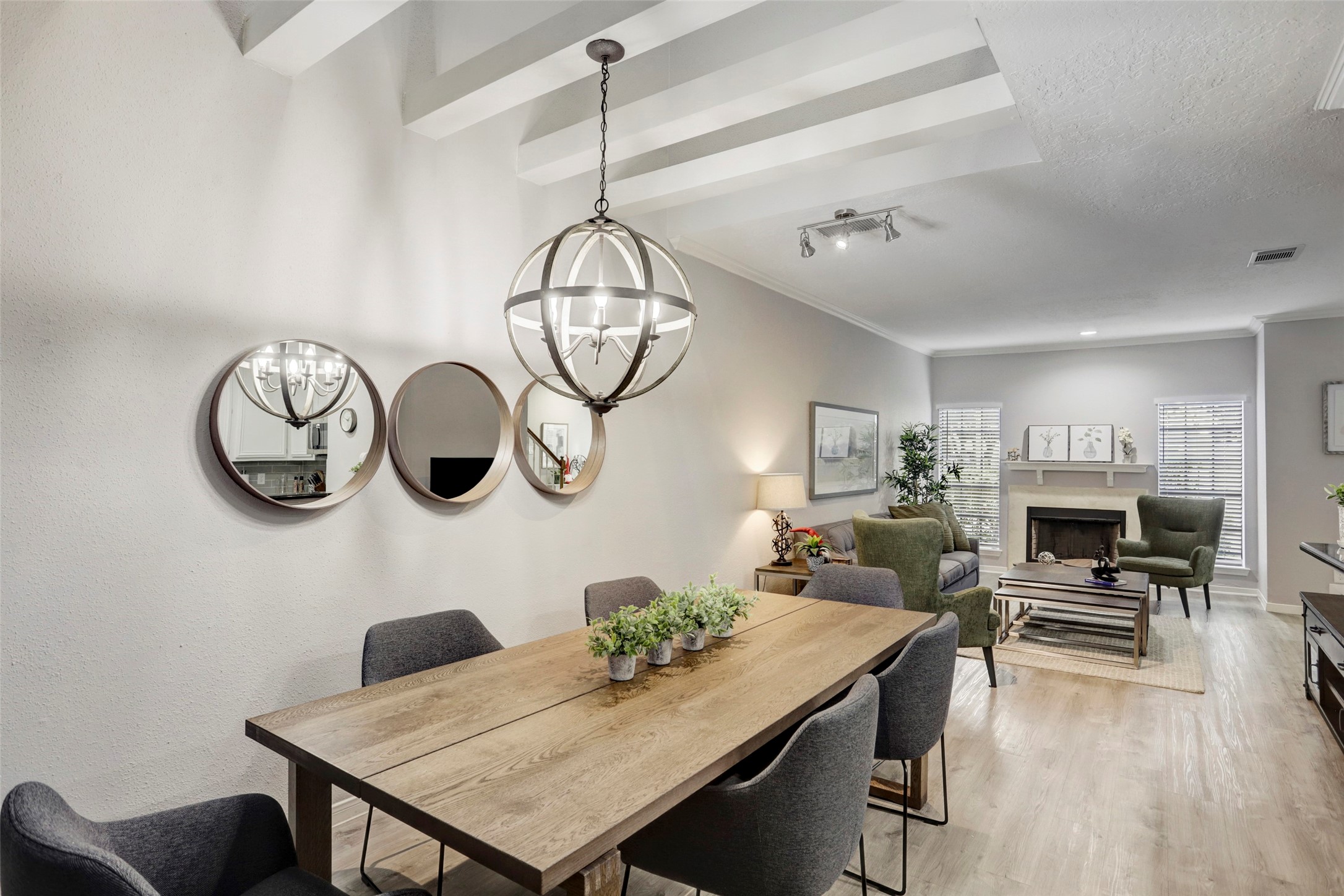 1911 Bering Drive, Unit 34 Houston, TX 77057 - Photo 10 of 26 a view of a dining room with furniture chandelier and wooden floor