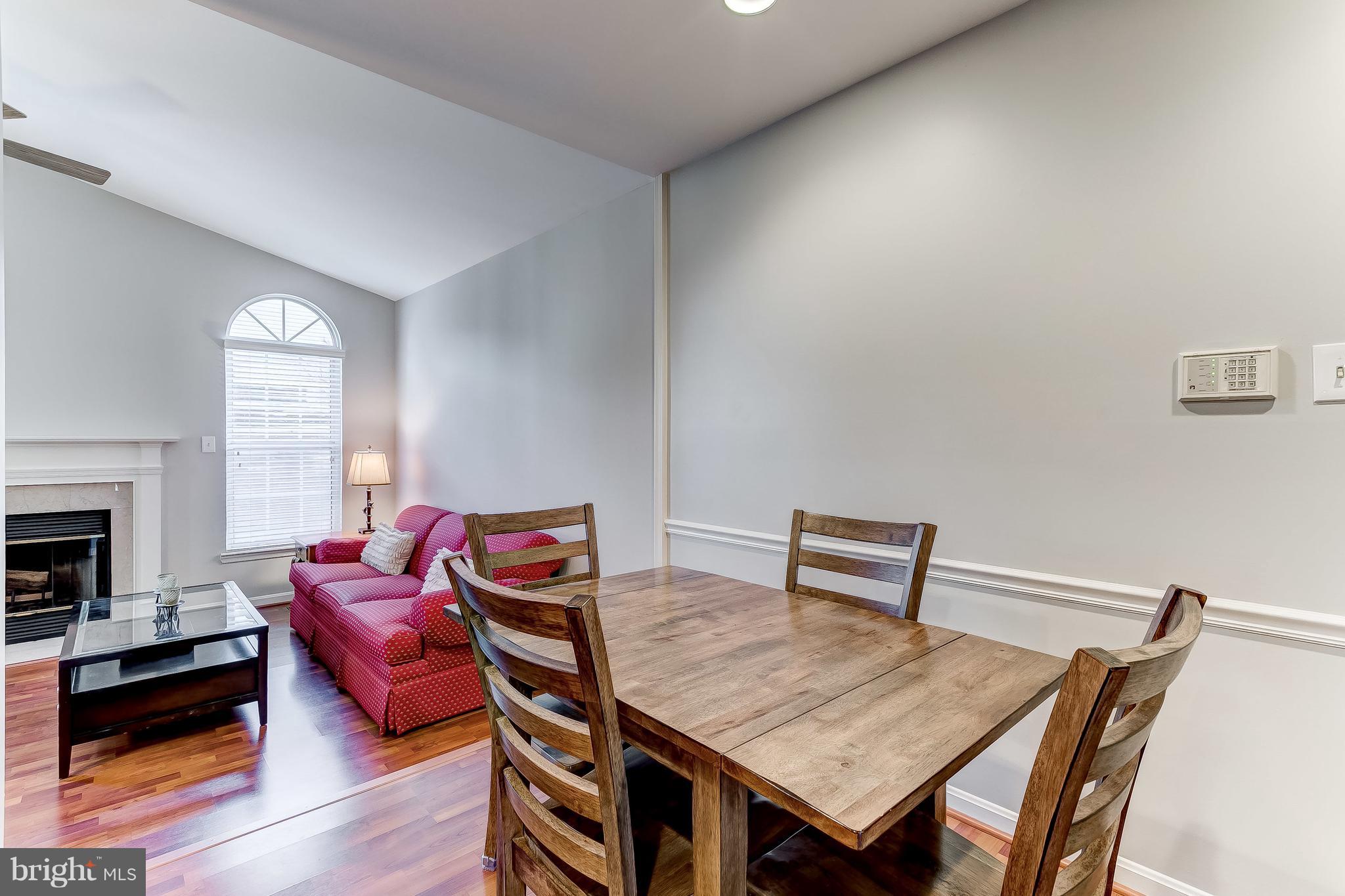 4313 Mispillion Road Baltimore, MD 21236 - Photo 14 of 38 a view of a dining room with furniture and wooden floor