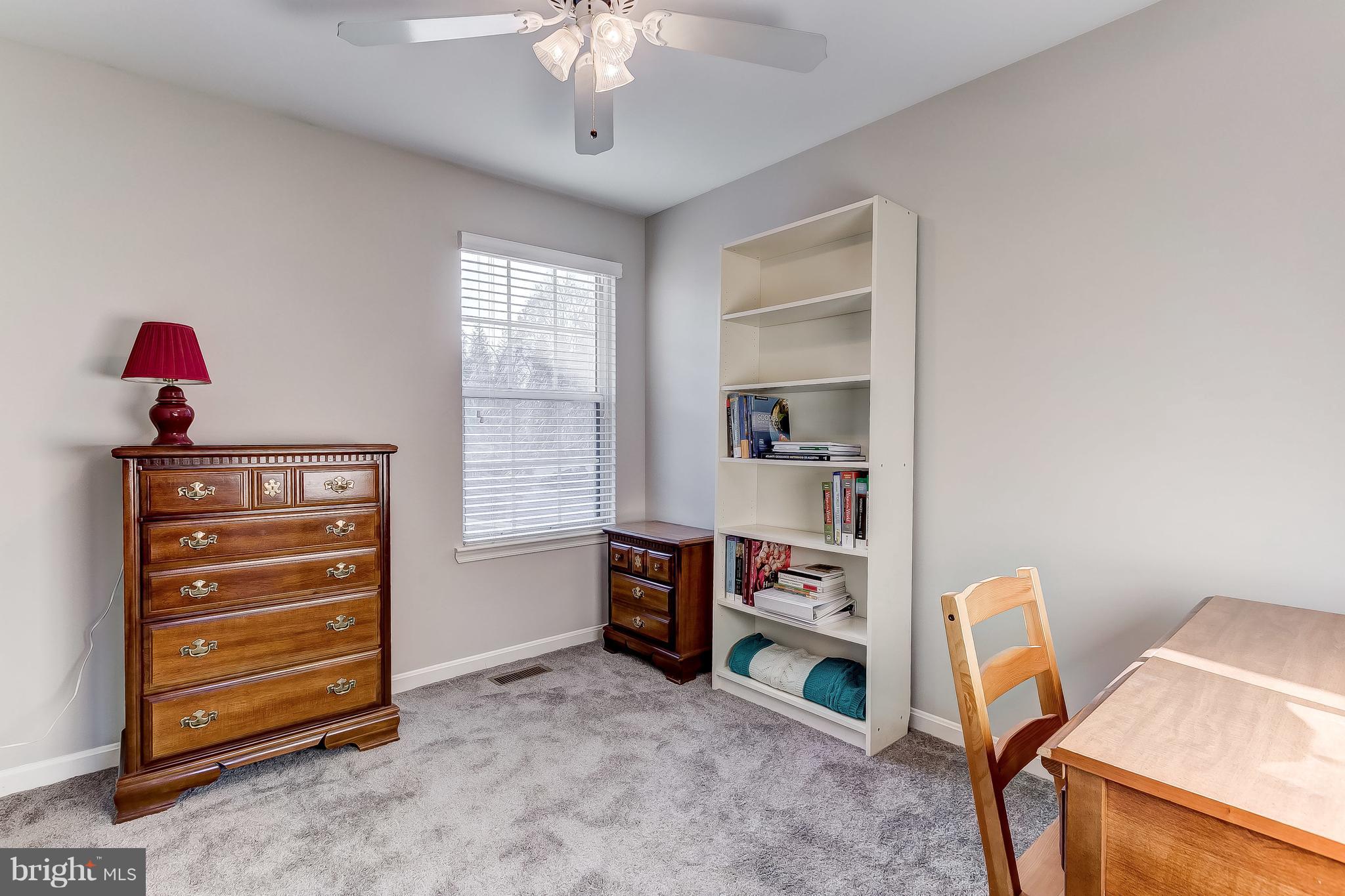 4313 Mispillion Road Baltimore, MD 21236 - Photo 27 of 38 a view of a workspace with furniture and a window