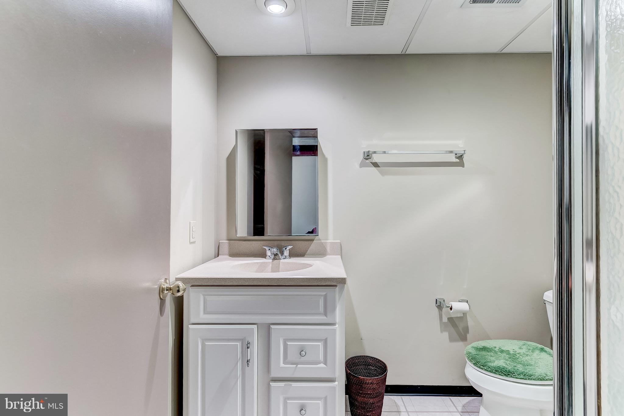 4313 Mispillion Road Baltimore, MD 21236 - Photo 33 of 38 a bathroom with a sink and a mirror