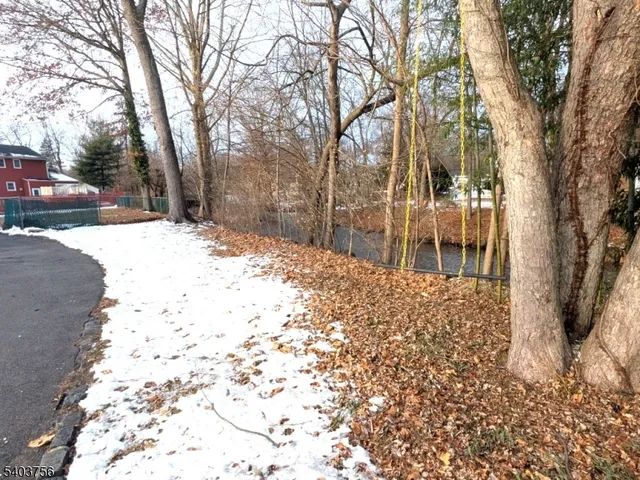 a wooden bench sitting in front of a building