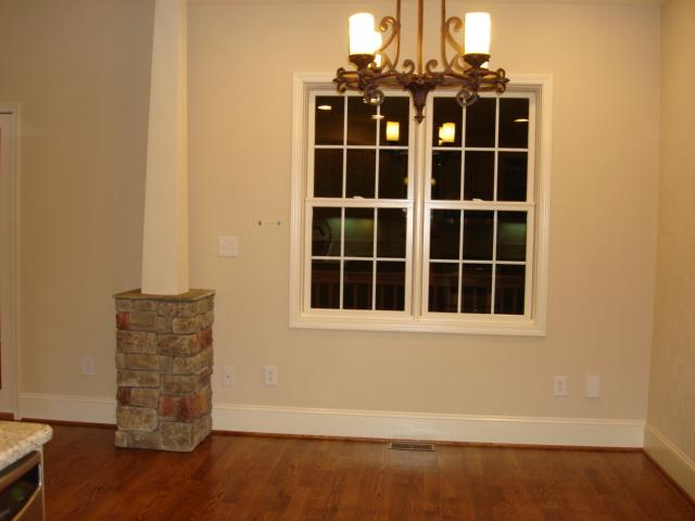 91 Stonehaven Lane Blue Ridge, VA 24064 - Photo 11 of 52 a view of an empty room with wooden floor and a window