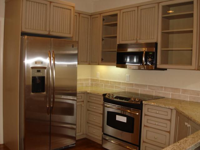 91 Stonehaven Lane Blue Ridge, VA 24064 - Photo 4 of 52 a kitchen with stainless steel appliances wooden cabinets and a stove top oven