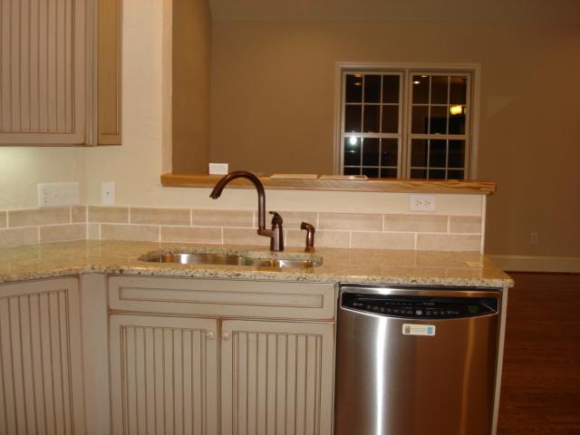 91 Stonehaven Lane Blue Ridge, VA 24064 - Photo 7 of 52 a kitchen with stainless steel appliances granite countertop a sink and cabinets