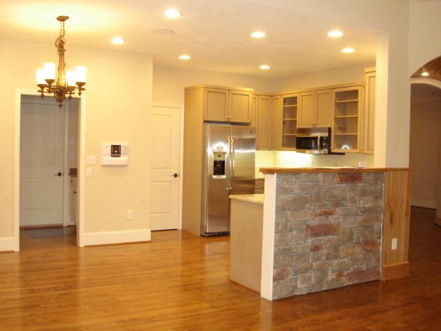 91 Stonehaven Lane Blue Ridge, VA 24064 - Photo 8 of 52 a view of a kitchen with kitchen island granite countertop wooden floor and a refrigerator
