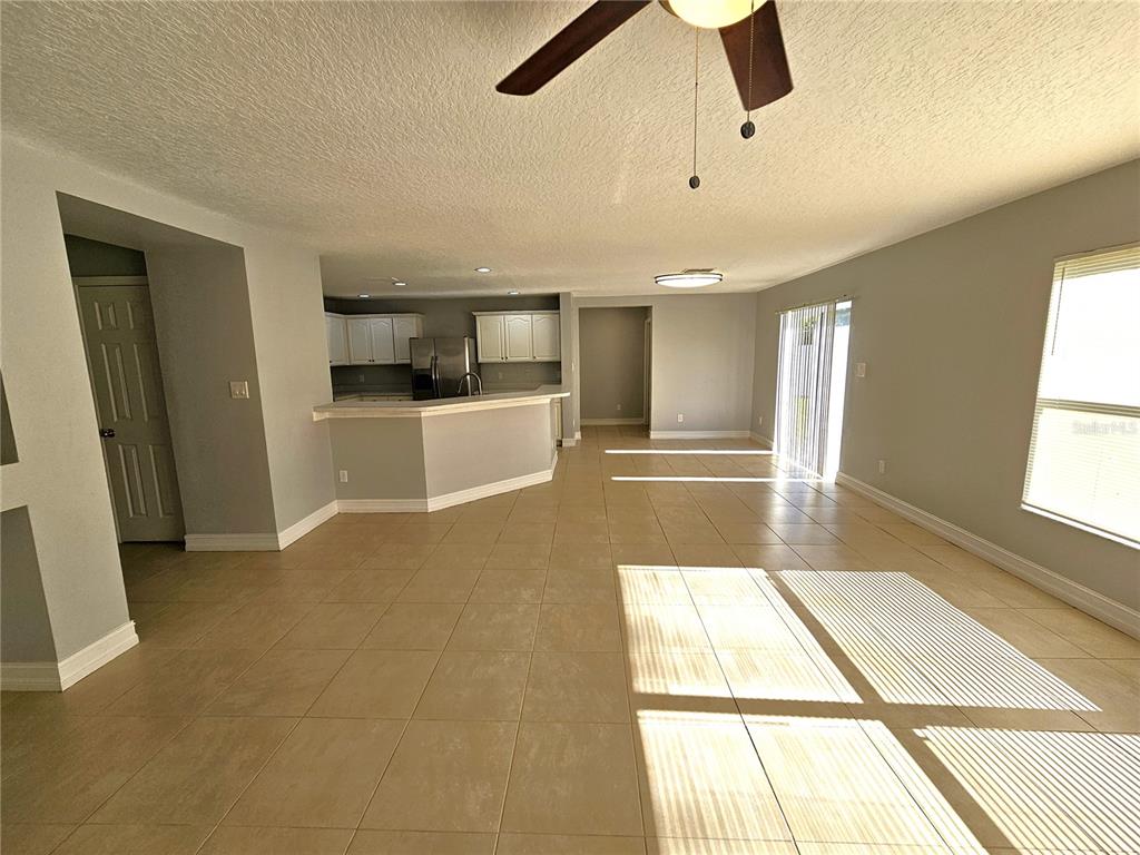 Undisclosed Address Orlando, FL 32818 - Photo 11 of 26 a view of a kitchen with a sink and a window