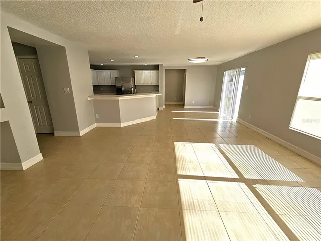 a view of a kitchen with a sink and a window