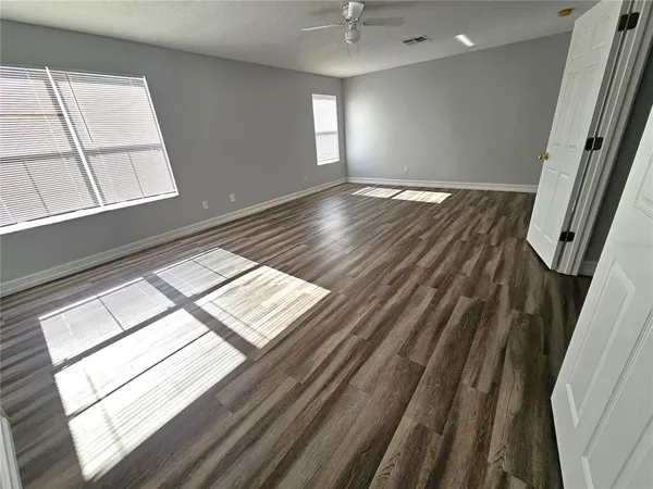 a view of an empty room and a window