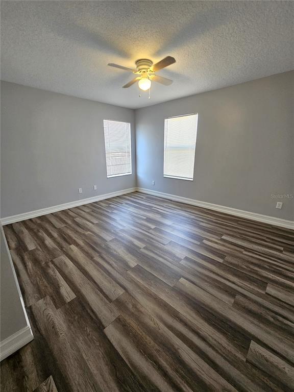 Undisclosed Address Orlando, FL 32818 - Photo 20 of 26 wooden floor in an empty room